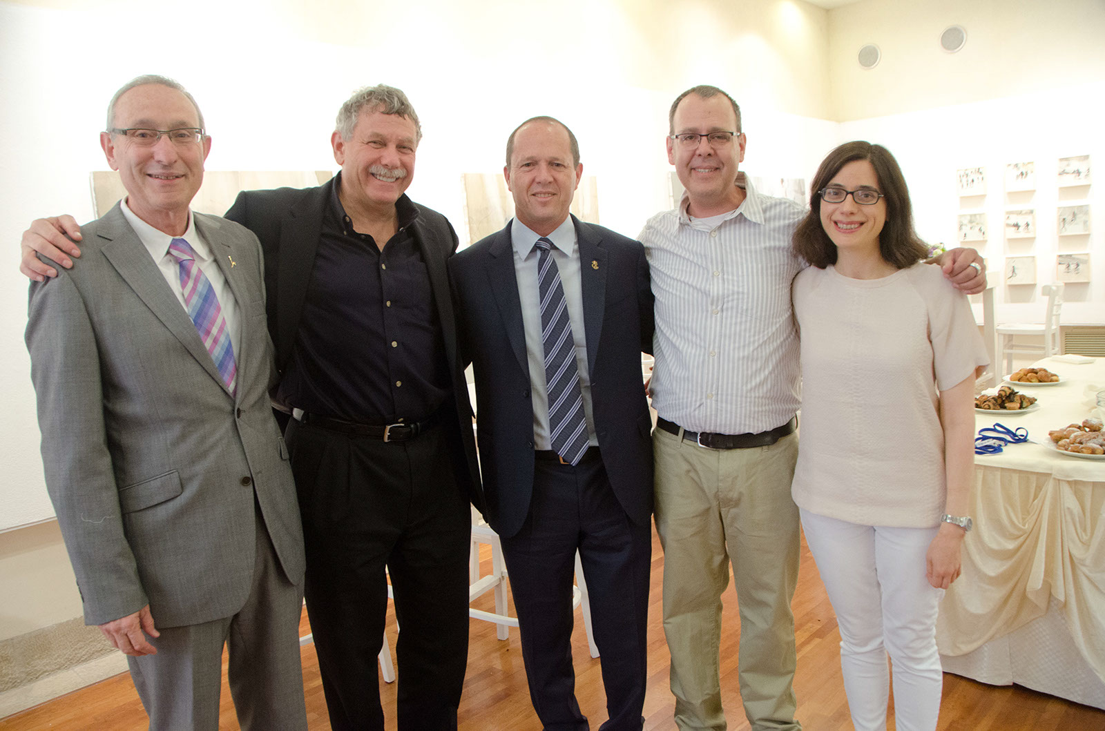 An image showing Jerusalem Mayor Nir Barkat (center) with Broad director/co-founder Eric Lander (left of Barkat) and Broad/MIT professor Aviv Regev (far right)